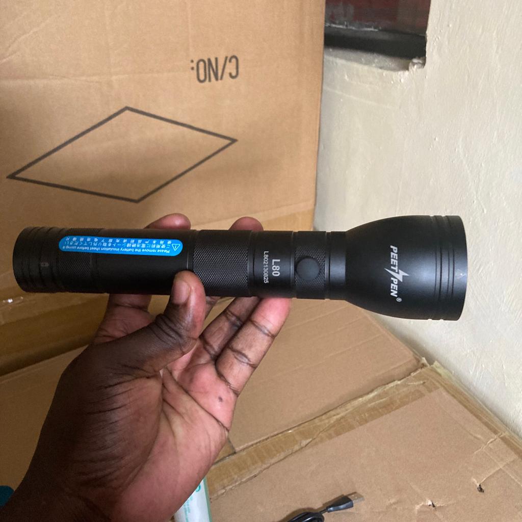 buy peetpen l80 long range brightest flashlight in kenya 3 Illuminate your path with unparalleled brightness and durability.The PEETPEN L80 Flashlight is engineered for professionals and outdoor enthusiasts seeking a reliable, high-performance lighting solution. With a powerful 1500-lumen output and a beam distance of up to 1 kilometer, this flashlight ensures visibility in the darkest environments. Its rugged design, featuring an IPX6 waterproof rating, makes it suitable for various weather conditions.