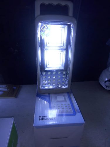 AKKO HK-348T Emergency Lamp for Home Outages AKKO HK-348T LED lamp illuminating home during Nairobi power outage, ideal for family safety.