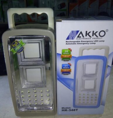 AKKO HK-348T LED lamp lighting up a home in Kenya during power outage, offering 15 hours of reliable brightness.