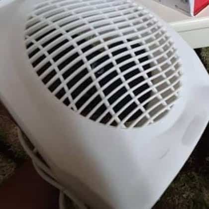 2000W Heater for Nairobi Homes Portable 2000W fan heater warming an office desk in Nairobi with adjustable thermostat for precise temperature control.