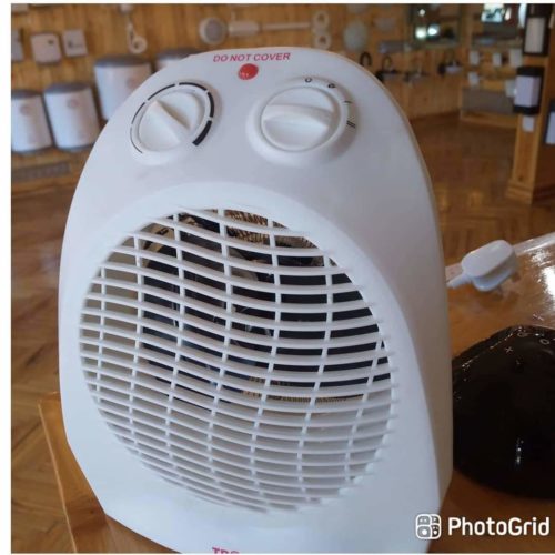 2000W Heater for Nairobi Homes 2000W fan heater warming a cozy office in Nairobi with adjustable thermostat for precise temperature control.