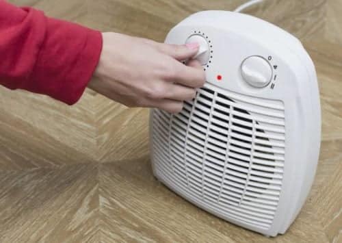 2000W Heater for Nairobi Homes Portable 2000W fan heater warming a chilly Nairobi office with adjustable thermostat for precise temperature control.