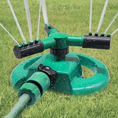 360° rotating sprinkler watering a vibrant garden in Nairobi, Kenya, covering up to 3400 sq ft for efficient lawn care.