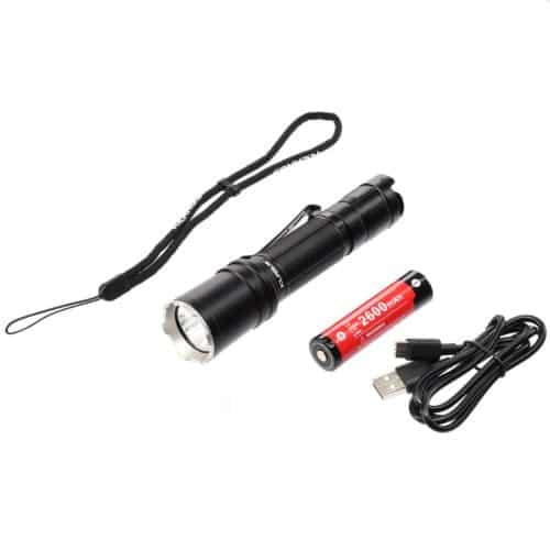 Klarus XT11R Hiking Beam Power Klarus XT11R flashlight in camping setup, 1300 lumens for illuminating trails in Kenya.