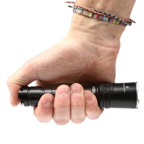 Klarus XT11R Hiking Beam Power Klarus XT11R flashlight lighting up a Kenyan campsite, ideal for 1300-lumen outdoor adventures in rugged terrain.
