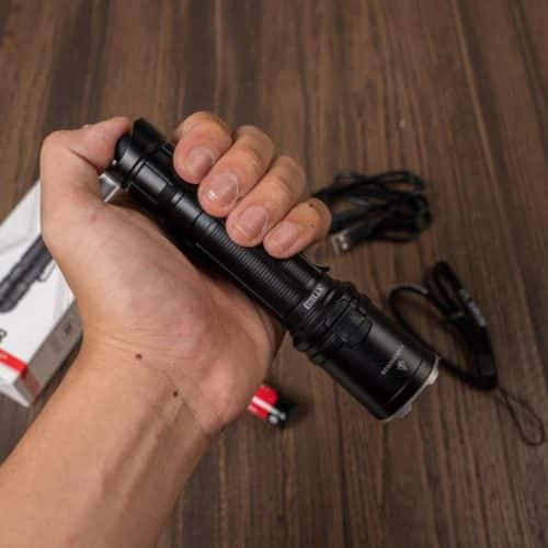 Klarus XT11R Camping Beam Power Klarus XT11R flashlight illuminating campsite with 300m beam for Kenya night camping.
