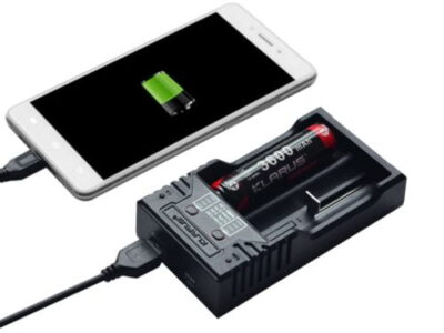 Klarus K2 smart charger with 1A fast charge for 18650 Li-ion batteries in home office setup.