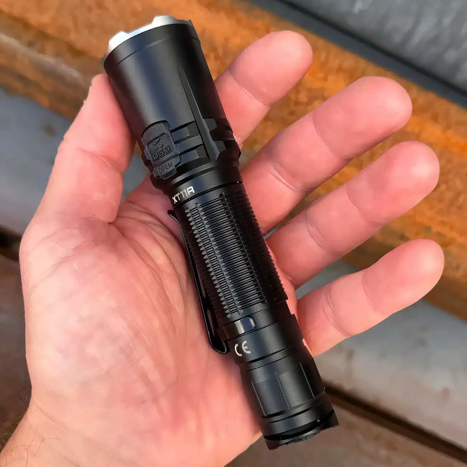 Klarus XT11R Torch Tactical Flashlight 2 klarus xt11r 2025 The Klarus XT11R is a powerful and compact LED flashlight designed for versatility, featuring a 1300-lumen output and a 300-meter beam. It offers three brightness levels, strobe mode, and USB-C recharging, making it ideal for camping, security, and everyday carry. ๐ ๏ธKey Features: โ
Max output of 1300 lumens and 300 meters beam distance โ
Dual tail switch for one-hand operation โ
3 brightness levels plus strobe mode โ
USB-C recharging with charging indicator โ
Runs on a 2600mAh 18650 rechargeable battery (included) โ
Crenelated front for self-defense and window-breaking โ
IPX8 waterproof rating โ
1-meter impact resistance โ
Lightweight aluminum alloy construction โ
Up to 200 hours runtime on low setting โฌ๏ธSCROLL DOWN TO SEE DESCRIPTIONโฌ๏ธ