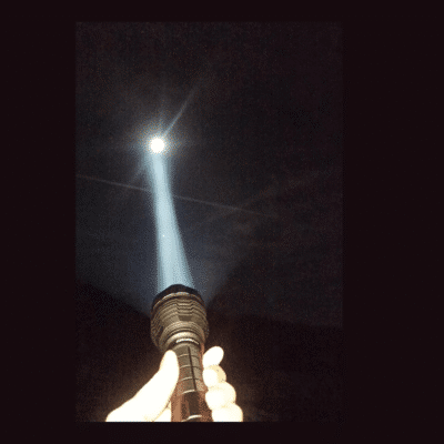Convoy L21A LED flashlight with 2300lm output for hiking trails in Kenya, featuring SST40 white tint and 4 brightness modes.