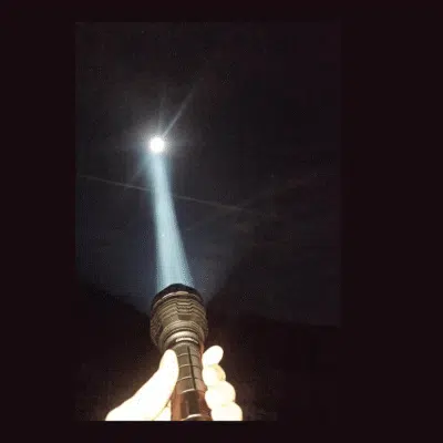 Convoy L21A LED flashlight with 2300lm output for hiking trails in Kenya, featuring SST40 white tint and 4 brightness modes.