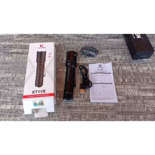 Klarus XT11R Camping Torch 1300LM Beam Klarus XT11R 1300LM flashlight illuminating a campsite in Kenya for nighttime adventures.