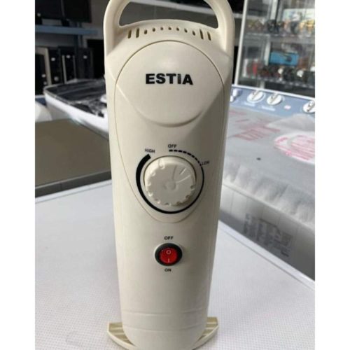 ESTIA Oil Radiator for Nairobi Living Rooms 1000W ESTIA oil radiator warming a small living room in Kenya, with efficient oil-filled fins for quick heat.