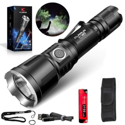 Klarus XT11X 3200 lumens LED flashlight in action for nighttime hiking trails in Kenya wilderness.