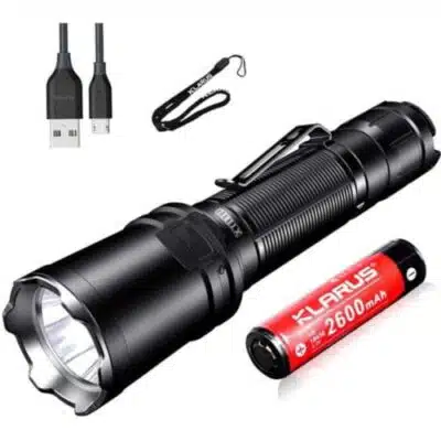 Klarus XT11R 1300LM flashlight illuminating campsite at night for secure camping adventures in Kenya.
