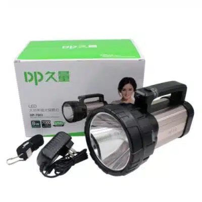 Dp-7303 Jumbo Flashlight illuminating a dark Nairobi street during evening power outage, with 7000mAh battery for extended emergency use.