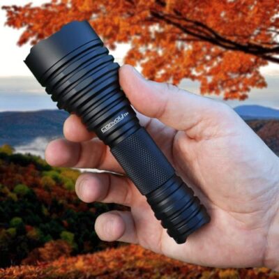Convoy C8+ flashlight with 700m beam illuminating security patrol in Nairobi, Kenya, ideal for night watch.