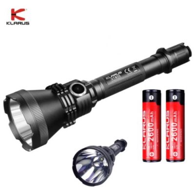 Klarus XT32 flashlight with 1200 Lumens beam illuminating targets during night hunting in forests.