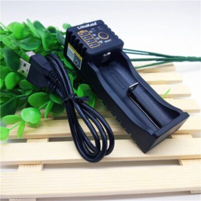 LiitoKala Lii-100 charger with USB output powering a flashlight for outdoor hikes.