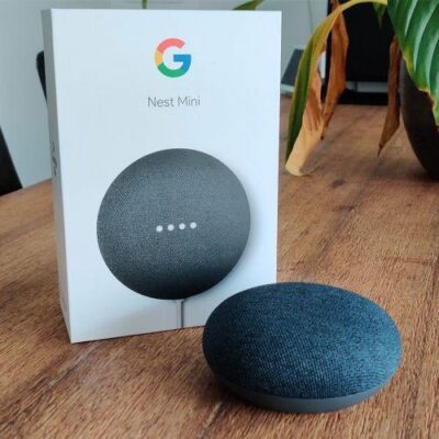 Compact Google Nest Mini smart speaker in Nairobi living room, streaming music via voice commands.