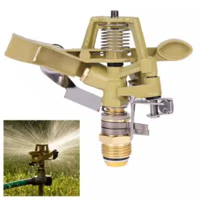Brass impact sprinkler watering yard grass with 0-360 degree adjustment for efficient lawn irrigation in suburban settings.