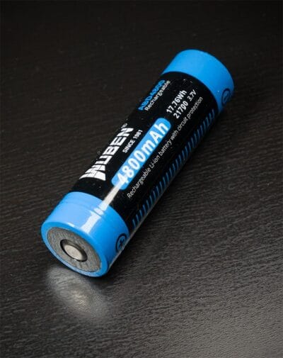 Wuben 21700 4800mAh battery in flashlight for night patrols in Nairobi, Kenya.