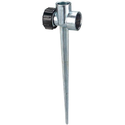 Durable 1/2 inch zinc flow-thru sprinkler spike base installed in a backyard garden for even lawn watering.