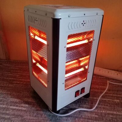 Four-sided 1600W quartz heater delivering 360ยฐ instant warmth in a living room for family gatherings.