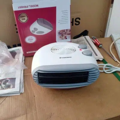 Premier 2000W Fan Heater with 1000W setting warming an office desk efficiently.