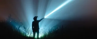 Klarus XT21X PRO flashlight in tactical mode for security patrols, 4400 lumens brightness for night operations in Kenya.