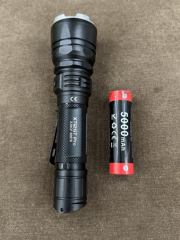 1753805814 The Klarus XT12GT PRO is a powerful, long-range tactical flashlight offering 1600 lumens and an 850-meter beam distance. It features a durable aircraft-grade aluminum alloy construction and is IPX8 waterproof, making it ideal for professional use, security, and outdoor activities like camping and hiking.
🛠️Key Features: ✅ Ultra Long-Distance Beam: Reach up to 850 meters, ideal for search, patrol, or field work.
✅ High Lumen Output: Equipped with Cree XHP35 HI LED delivering up to 1600 lumens.
✅ High Capacity Battery: Comes with a 5000mAh 21700 rechargeable lithium-ion battery.
✅ USB-C Charging: Fast, safe charging cable.
✅ Dual Tactical Tail Switches: Instant access to turbo, strobe, and light modes.
✅ Waterproof and Durable: IPX8 rated, submersible up to 2 meters; built from aircraft-grade aluminum.
✅ Six Light Modes: Turbo, High, Medium, Low, Strobe, and SOS for multiple scenarios.
✅ Mode Memory + Battery Indicator: Remembers last used mode and shows battery status. ⬇️SCROLL DOWN TO SEE DESCRIPTION⬇️